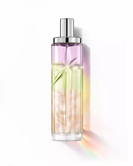 Yummy Swirl: flacone alto con sfumatura viola, verde e arancione su sfondo bianco.